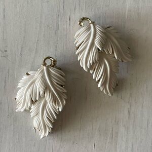 Lisner white gold tone clip on vintage earrings, leaf design, white Lucite?